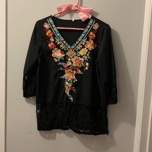 Black Top with colorful flower design and black lace.  Size M.